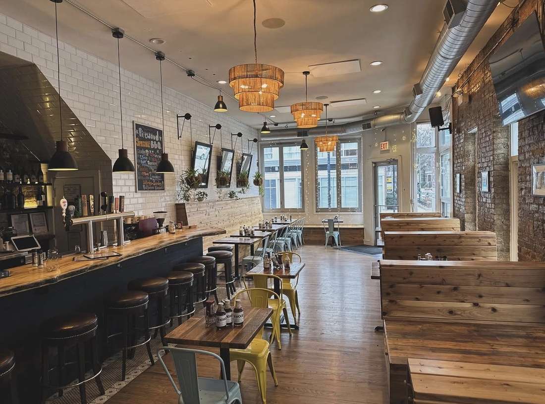 Inside Pierogi Kitchen — warm wood booths, exposed brick and a full bar in Wicker Park Chicago